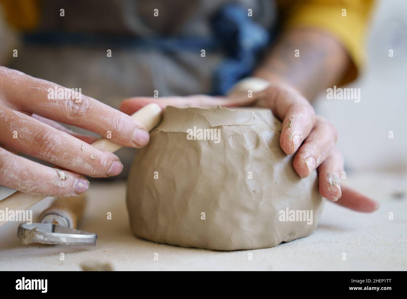 Ceramics creation process: female artist shaping and sculpting clay ...