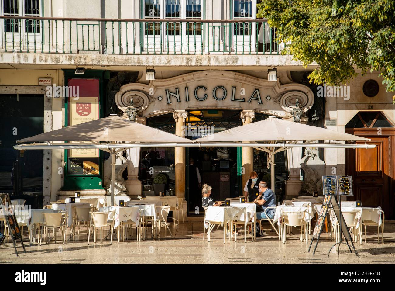 the cafe Nicola at the Rossia Square in Baixa in the City of Lisbon in Portugal.  Portugal, Lisbon, October, 2021 Stock Photo