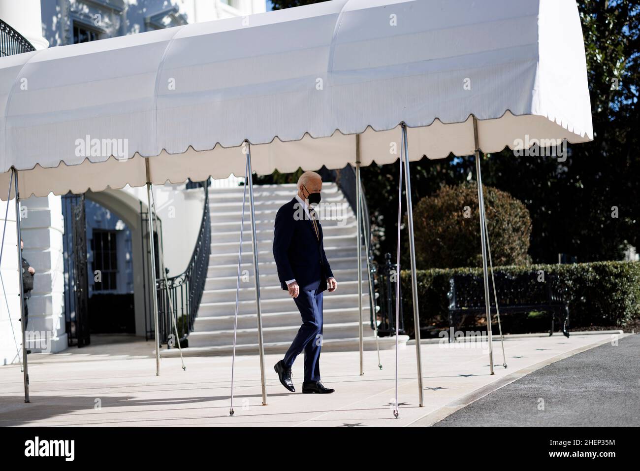 Washington, USA. 12th Jan, 2022. U.S. President Joe Biden walks out from the South Portico of the White House in Washington, DC, the United States, on Jan. 11, 2022. U.S. President Joe Biden in a speech Tuesday in Atlanta, Georgia, said he supports changing the Senate filibuster rule so as to make it easier for the chamber to pass legislation upholding Americans' right to vote. Credit: Ting Shen/Xinhua/Alamy Live News Stock Photo