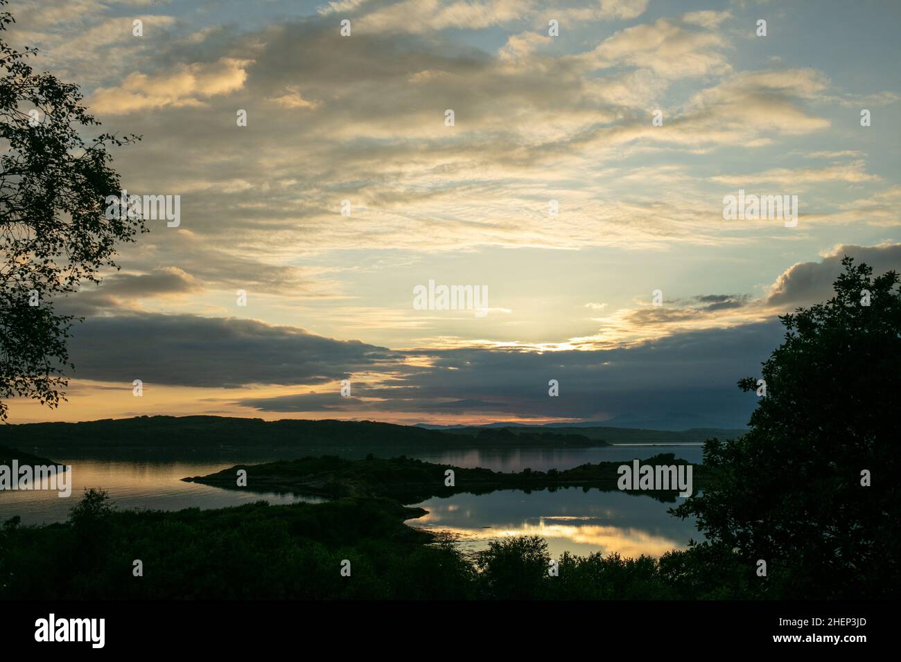 Cloudy sunset over the Loch Shuna in Scotland. Sunset over Loch Shuna in Craobh Haven, Argyll and Bute in Scotland. Stock Photo
