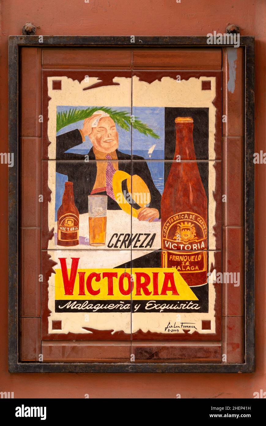 Ceramic tile advertising poster for Victoria beer brewed in Malaga, Spain - Cervezas Victoria Malagueña y exquisita Stock Photo