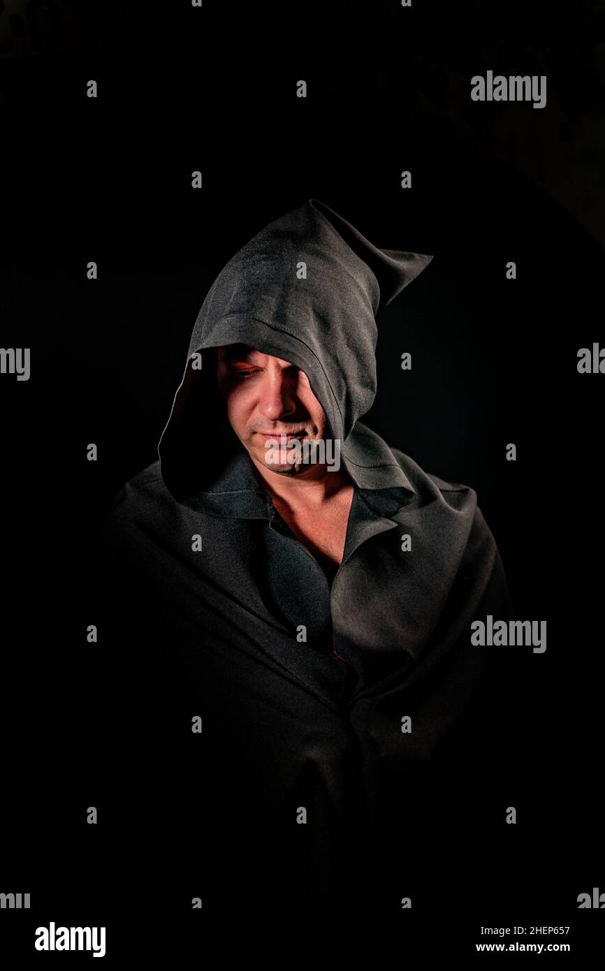 Black cloak hi-res stock photography and images - Alamy