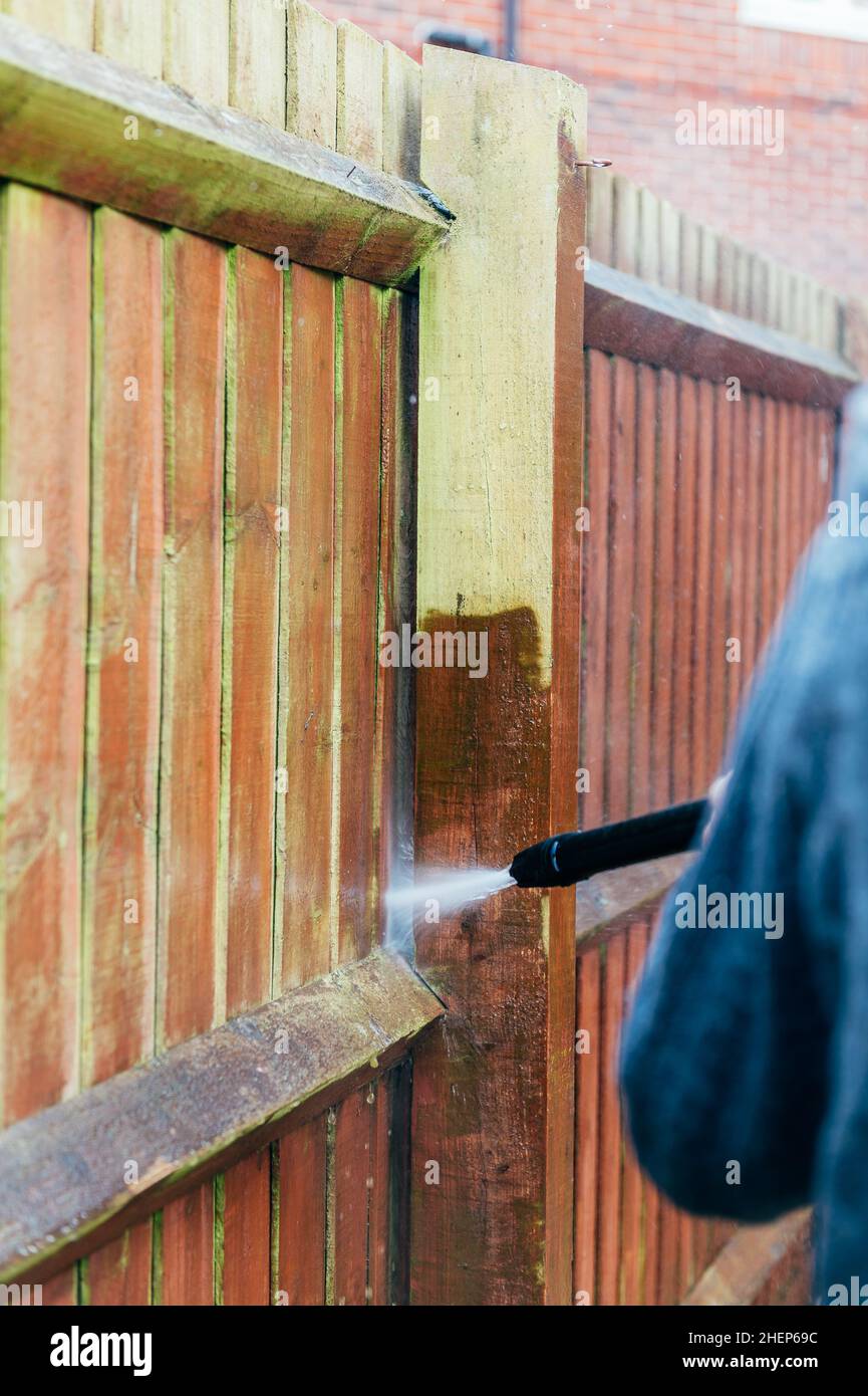 Cleaning of Wood Fence with pressure washer Stock Photo Alamy