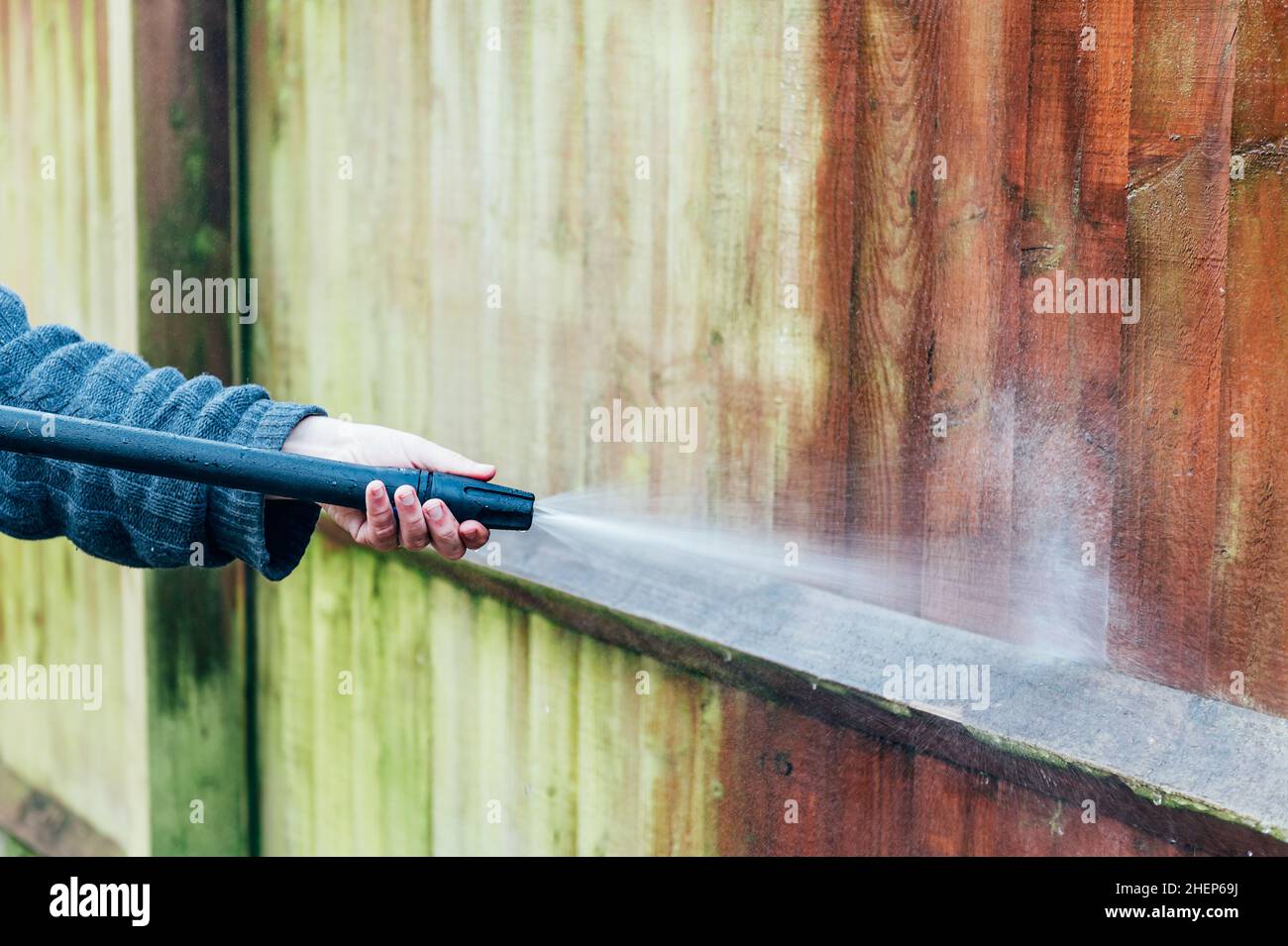 Cleaning of Wood Fence with pressure washer Stock Photo Alamy