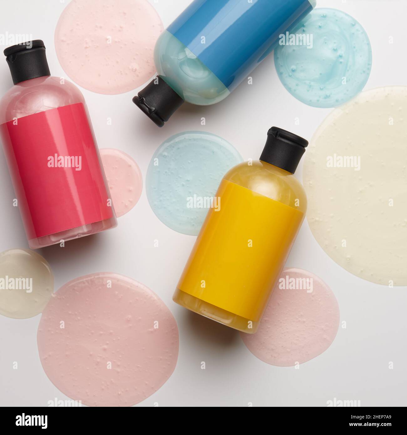 Color bottles with shower gels on white background Stock Photo - Alamy