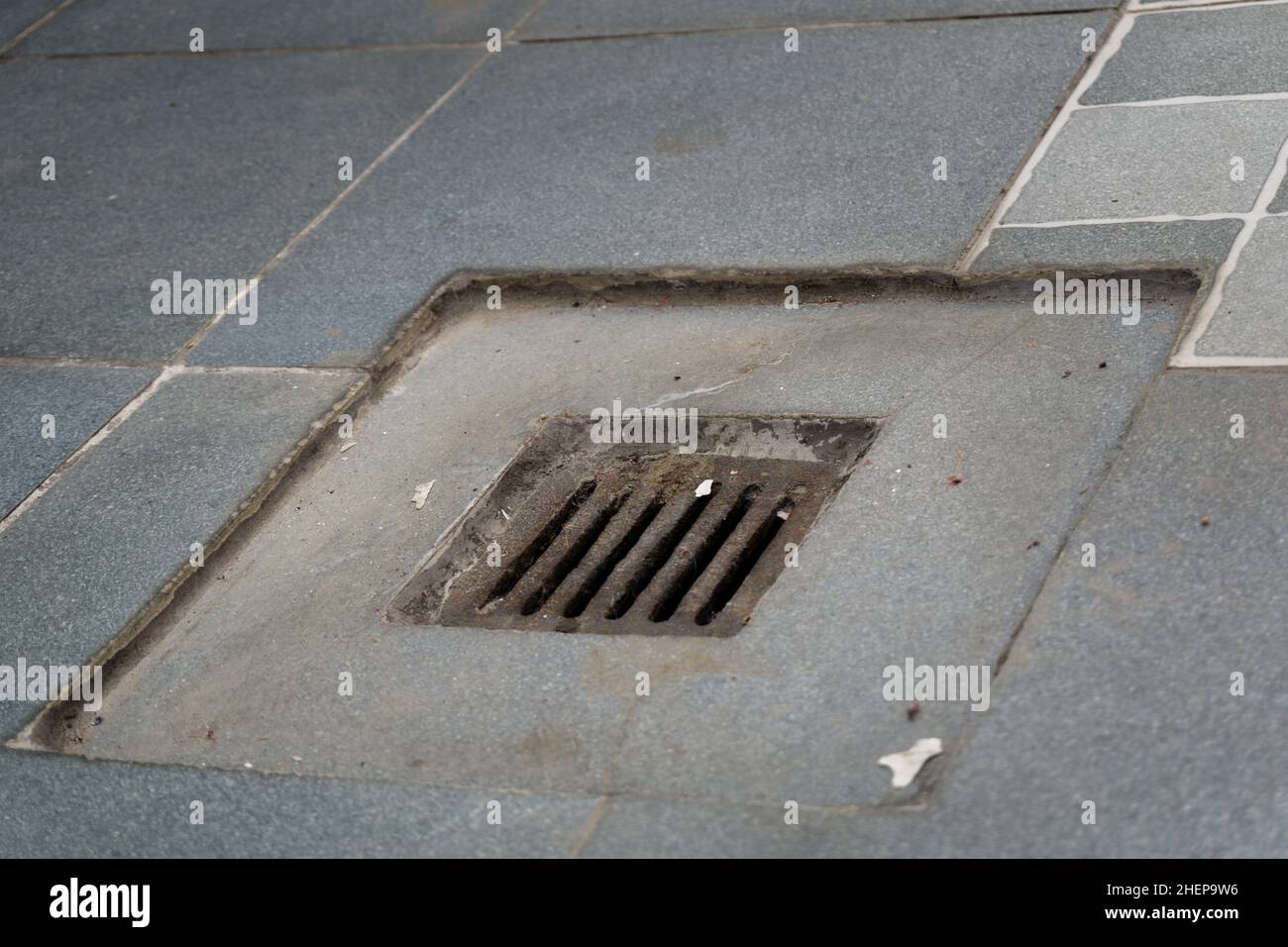 A close-up shot of water drainage on the tiled roof. Stock Photo