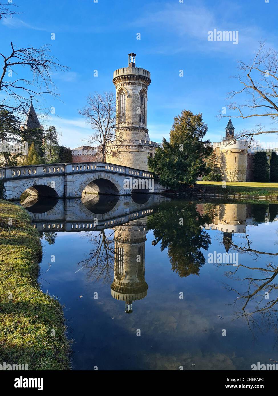 Laxenburg, Austria - January 02, 2022: Franzensburg Castle and stone bridge in public castle park, a preferred destination and film location near Vien Stock Photo