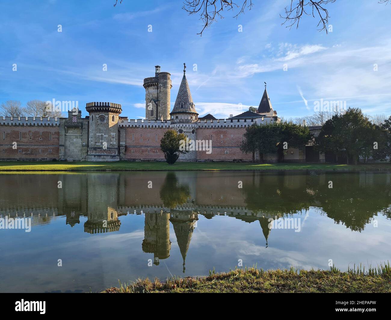 Laxenburg, Austria - January 02, 2022: Franzensburg Castle in lake of public castle park, a preferred destination and film location near Vienna Stock Photo
