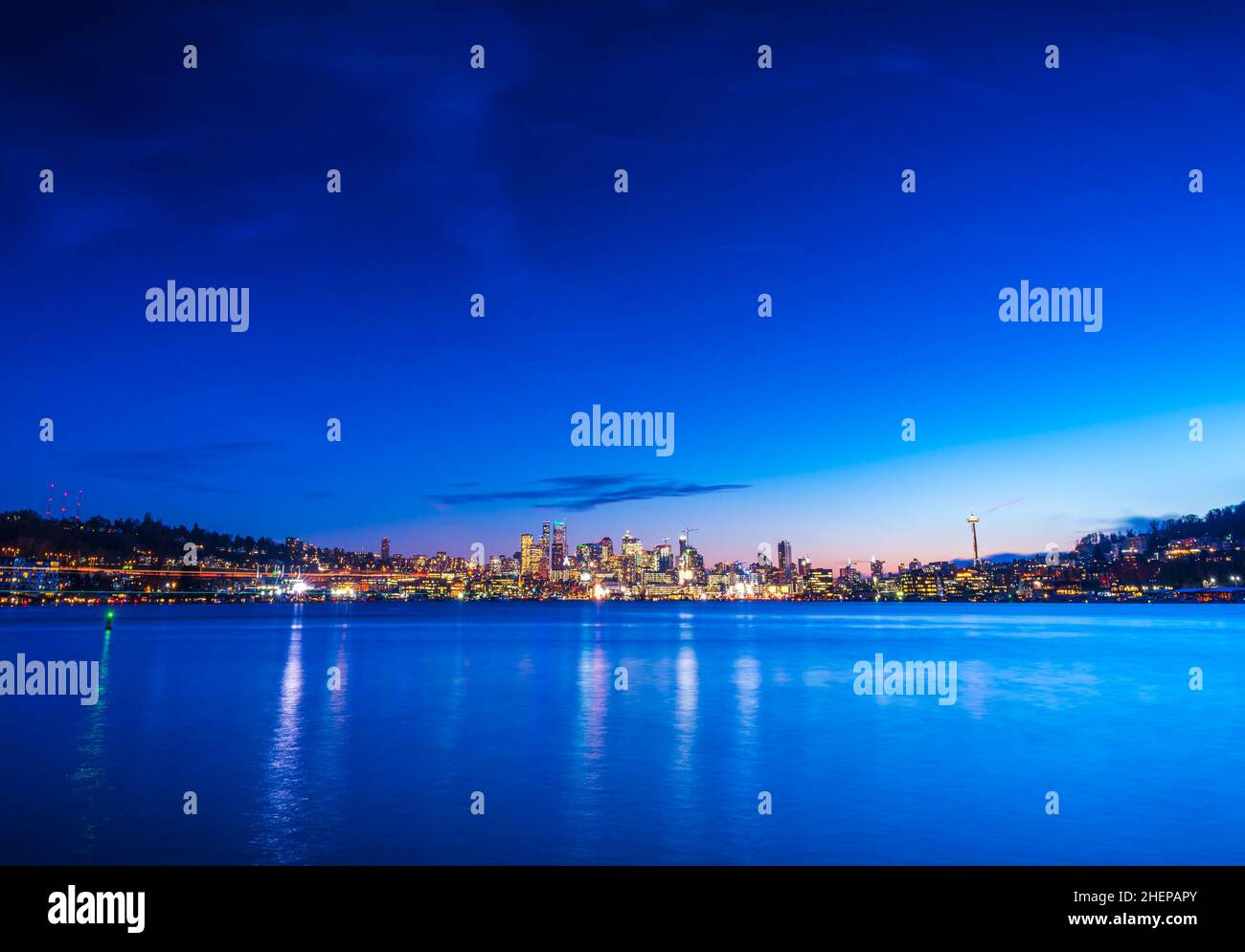 seattle city skyline at night with reflection in water. seattle ...