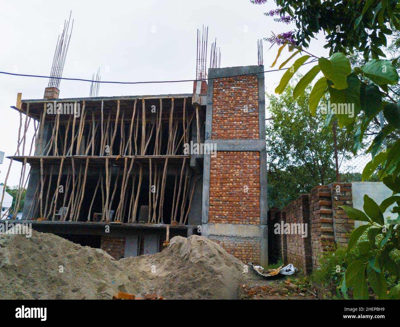 editorial dated- 18th Jun '2020 location - Dehradun INDIA. An under-construction multiple-story building. Stock Photo