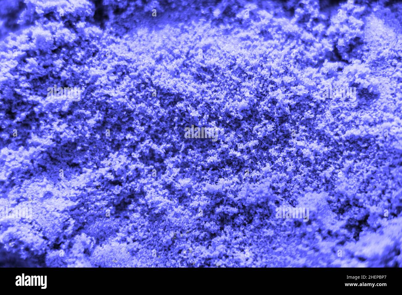 Abstract texture of the periwinkle purple kinetic sand. Stock Photo