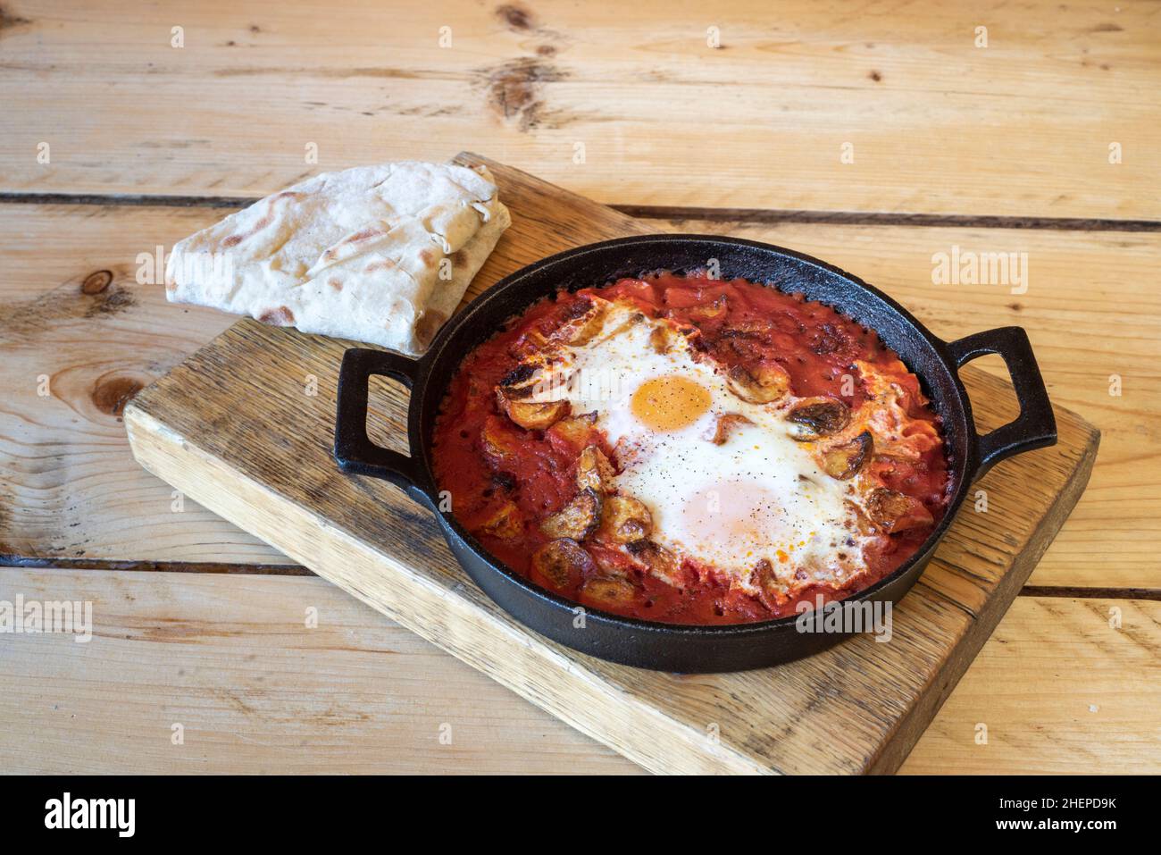 Egg, tomato & mushroom vegetarian breakfast sizzler in tomato sauce