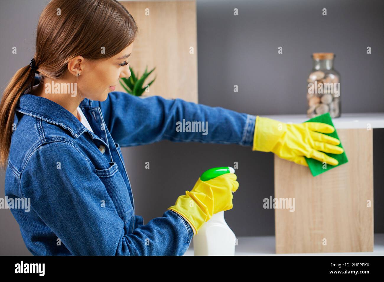 https://c8.alamy.com/comp/2HEPEK0/pretty-woman-in-uniform-with-supplies-cleaning-in-office-2HEPEK0.jpg