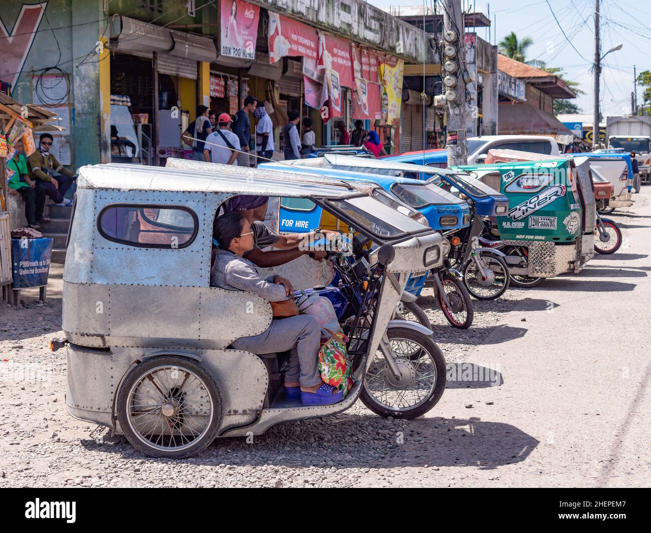 Motorised tricycle taxis at the market in Maasim, a small town in the Sarangani Province at the southern tip of Mindanao, the southernmost major islan Stock Photo