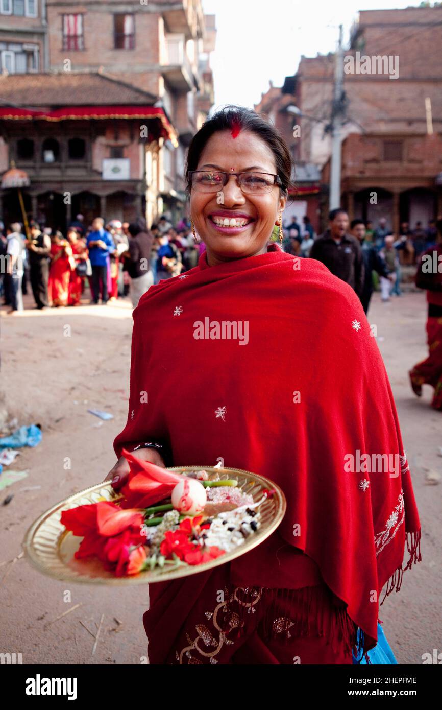 Bhaktapur local making puja during Bisket Jatra, the Nepali New Year Hindu celebration held in the UNESCO World Heritage city of Bhaktapur. Stock Photo