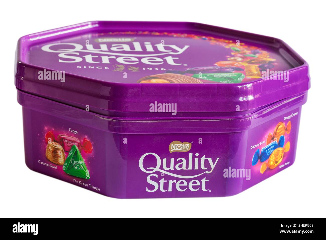 Tub of Nestle Quality Street chocolates sweets isolated on white background Stock Photo