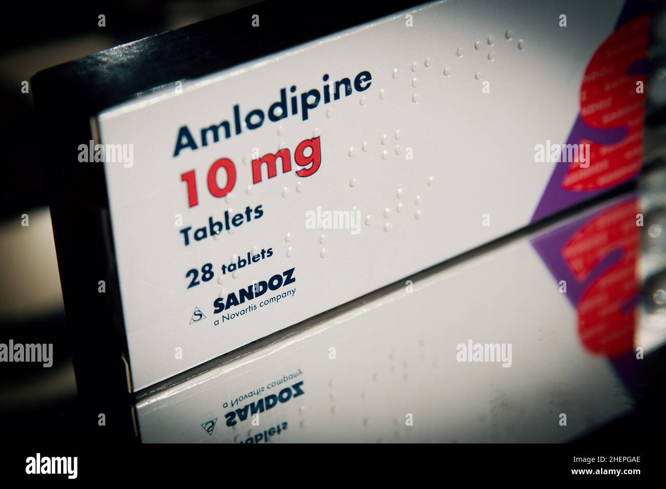 A box of Sandoz International GmbH branded Amlodipine medication, used for treating high blood pressure or heart-related chest pain, in London, UK. Stock Photo