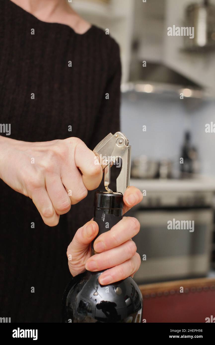 Opening a wine bottle Stock Photo Alamy