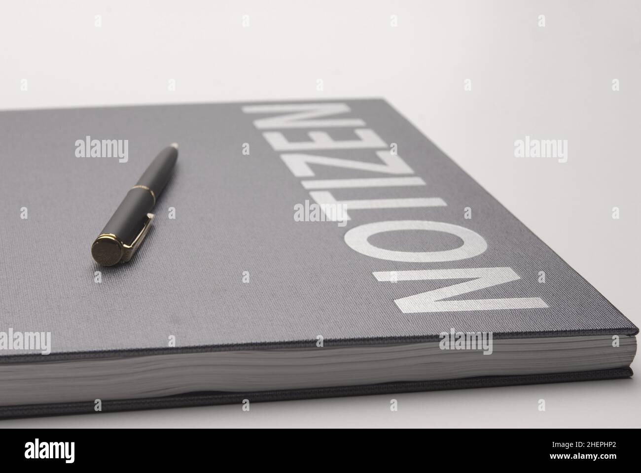 Note-book with a biro Stock Photo