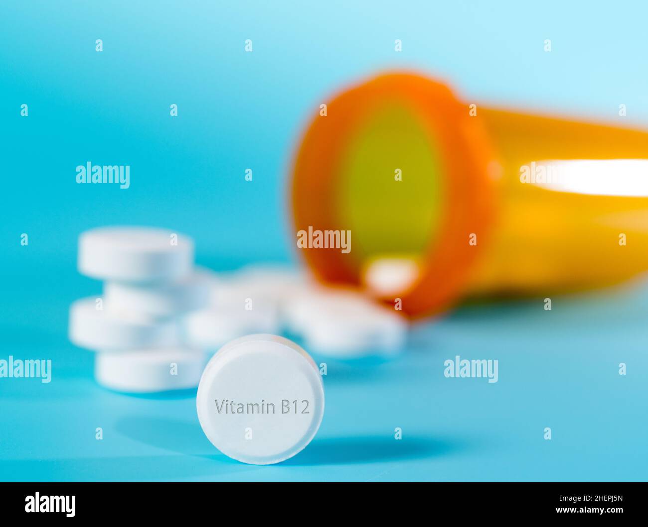Vitamin B12 pills Vitamin B12 is a nutrient helps keep blood and nerve cells healthy and helps make DNA, the genetic material, prevent megaloblastic a Stock Photo