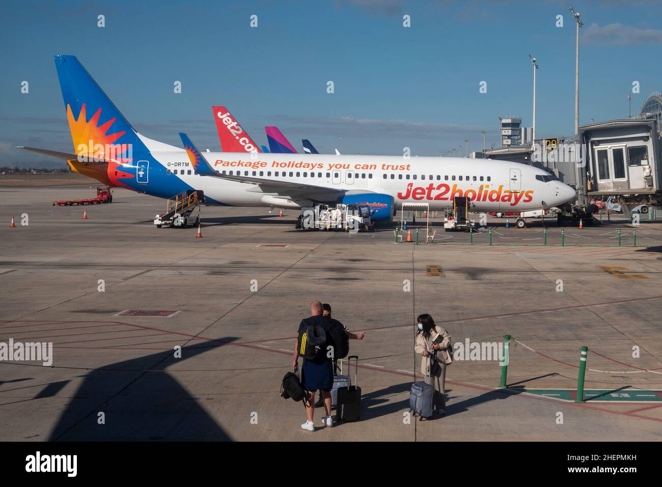 Alicante Elche Airport. Passengers walking to a plane, with