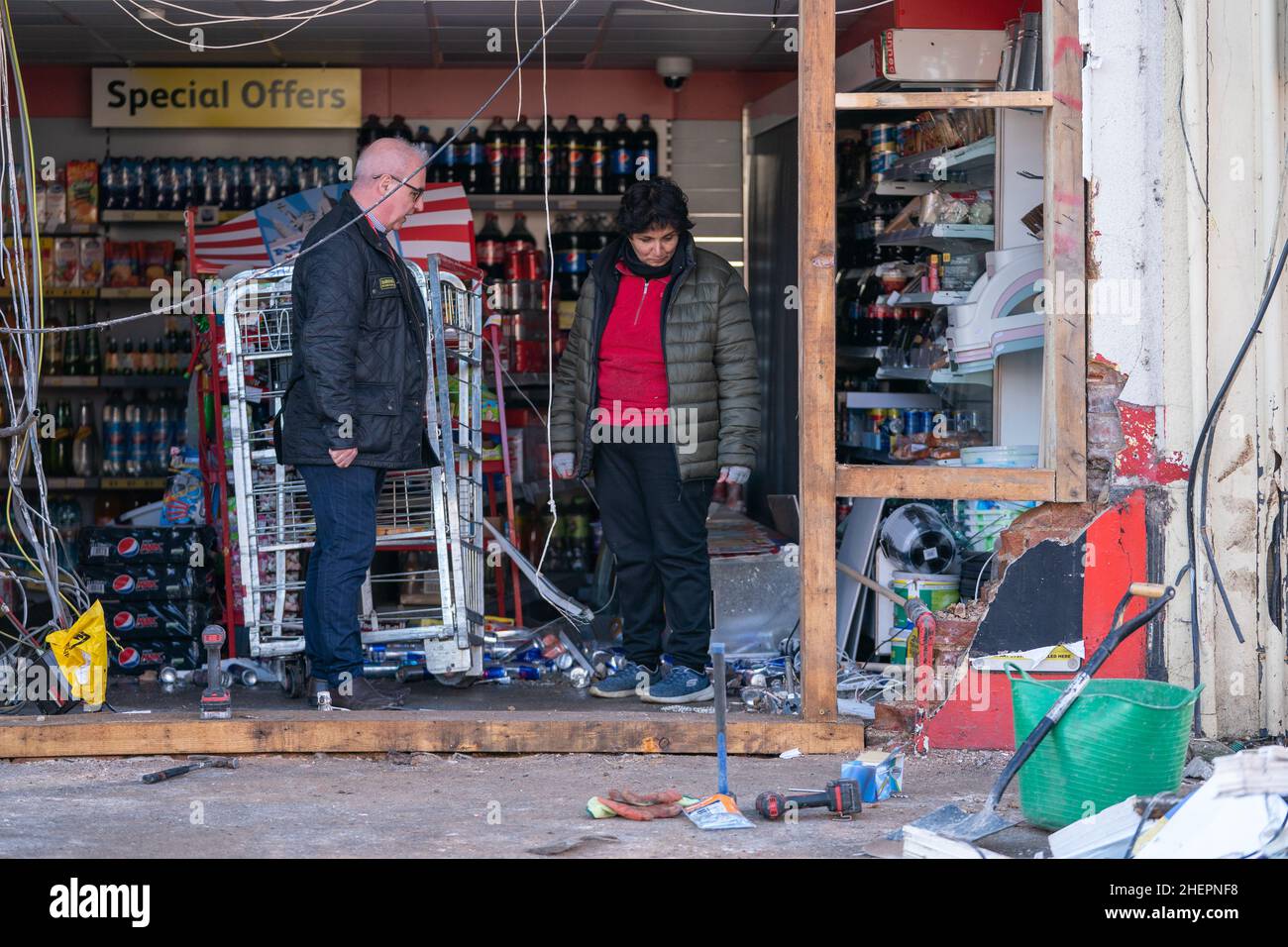 The scene at Walsoken Post Office in Wisbech, Cambridgeshire, after thieves broke in using a JCB low loader and made off with the cash machine in the early hours of the morning. Cambridgeshire Police believe that the incident is linked to another ATM theft in Yaxley last night and similar incidents in Chatteris and Cambridge last week. Picture date: Wednesday January 12, 2022. Stock Photo