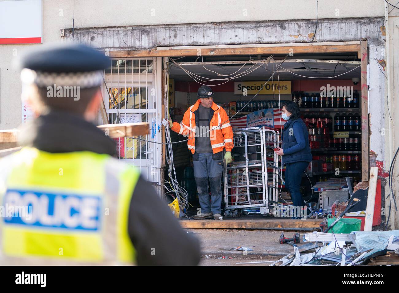 The scene at Walsoken Post Office in Wisbech, Cambridgeshire, after thieves broke in using a JCB low loader and made off with the cash machine in the early hours of the morning. Cambridgeshire Police believe that the incident is linked to another ATM theft in Yaxley last night and similar incidents in Chatteris and Cambridge last week. Picture date: Wednesday January 12, 2022. Stock Photo