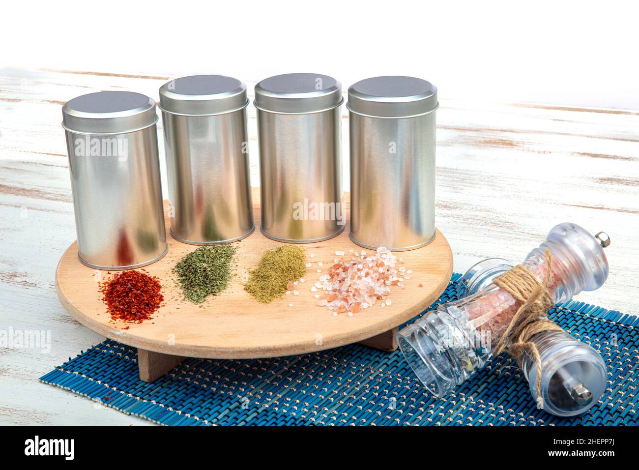 Spices on a pantry shelf. Spices in tin cans. Stock Photo