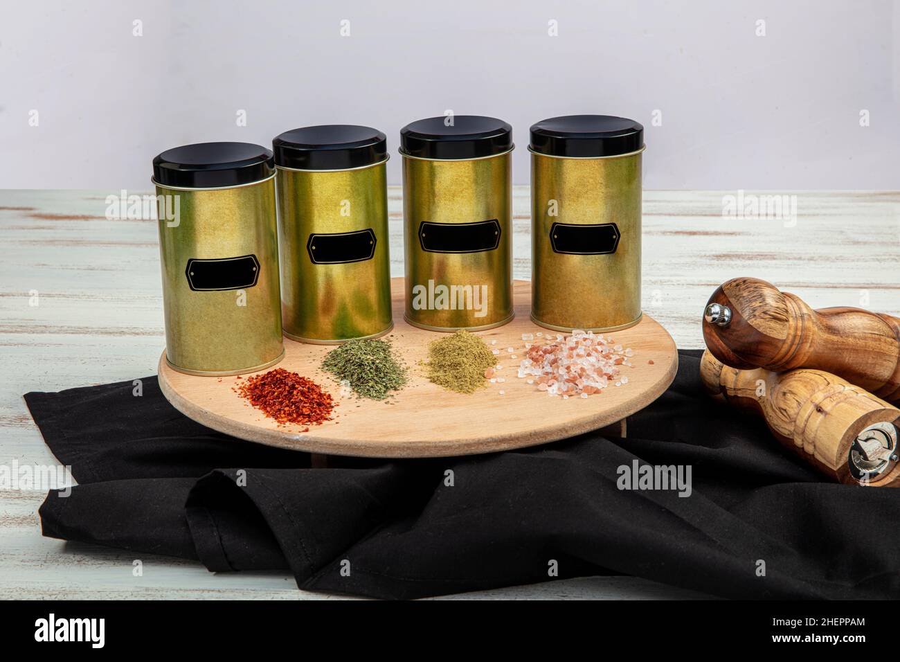 Spices on a pantry shelf. Spices in tin cans. Stock Photo