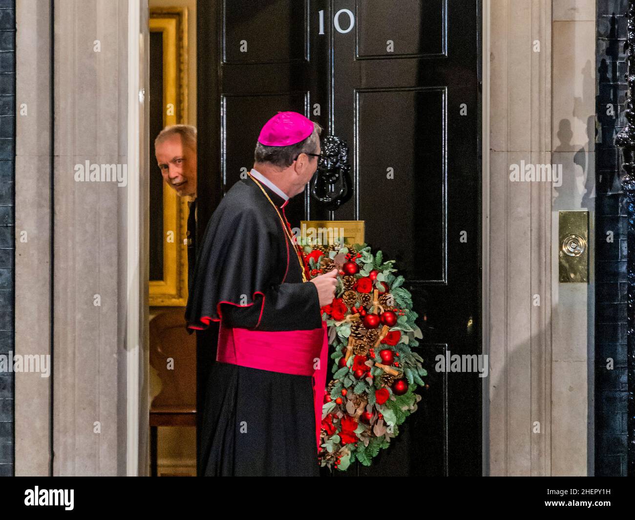London, UK. 1st Dec, 2021. A priest arrives at the door of Number 10 Downing Street. Credit: Guy Bell/Alamy Live News Stock Photo