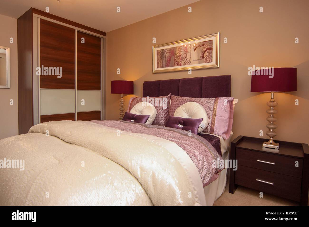 Cream gold and dark red bedroom,double kingsize bed, wardrobe,new build home,bedside tables and