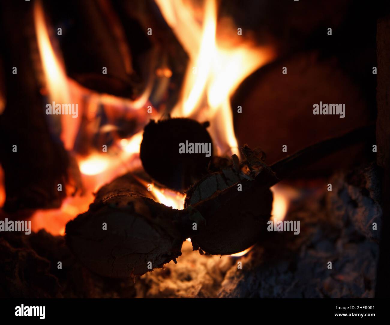 Bright fire of high temperature from firewood burns in fireplace Stock