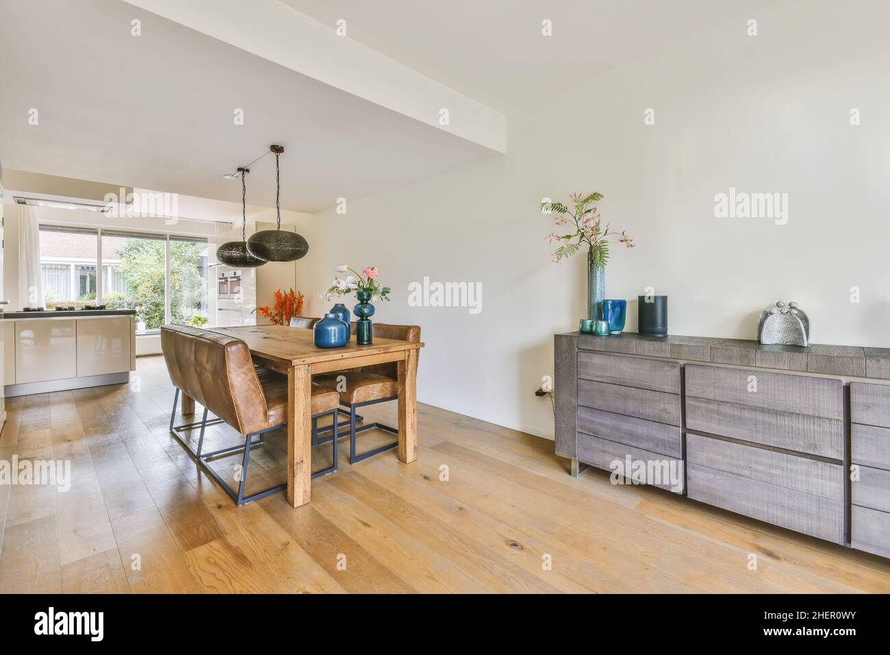 Wonderful dining room with wood table and blue decor Stock Photo - Alamy