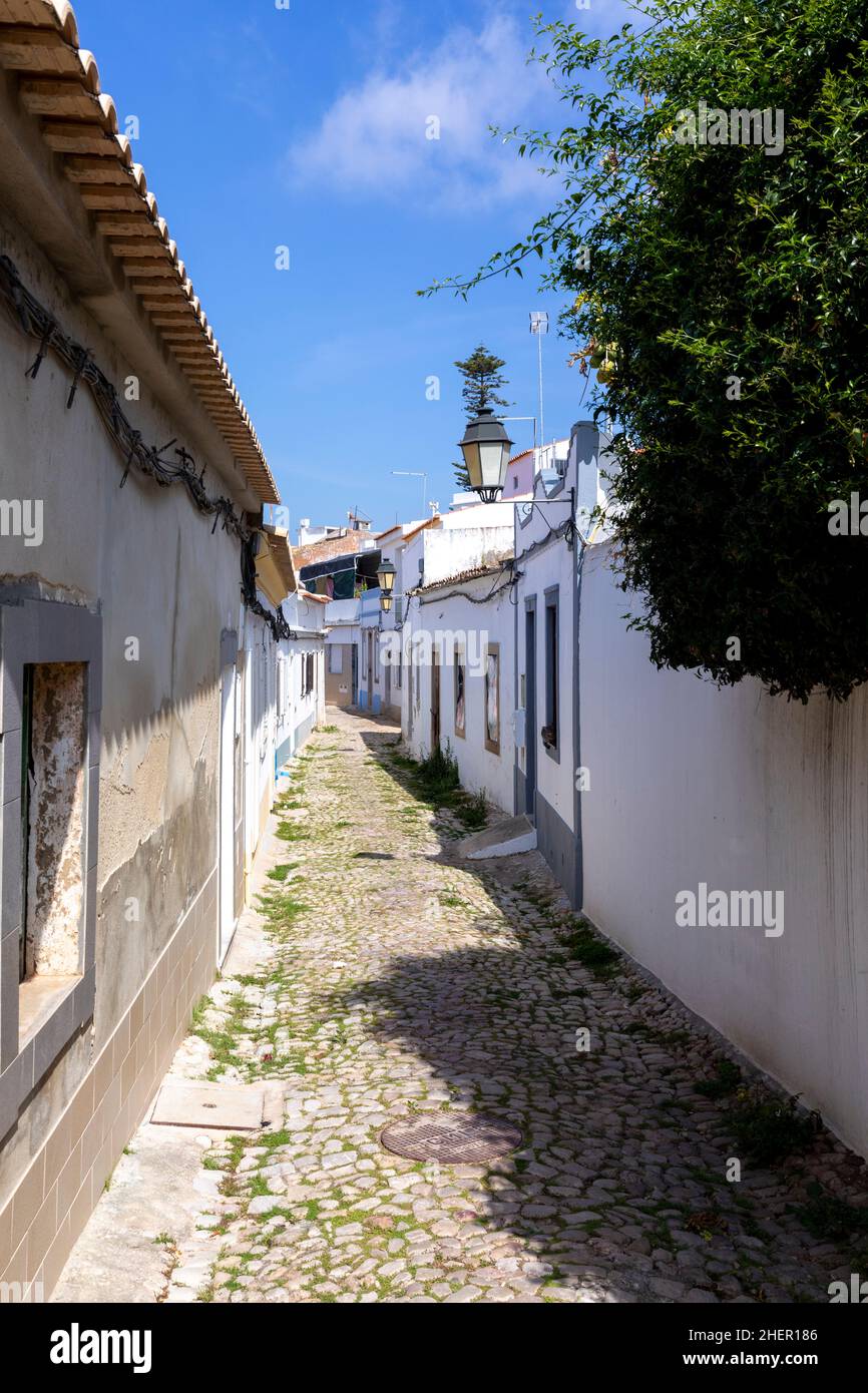 small road with old traditional houses in Loule, Algarve, Portugal Stock Photo