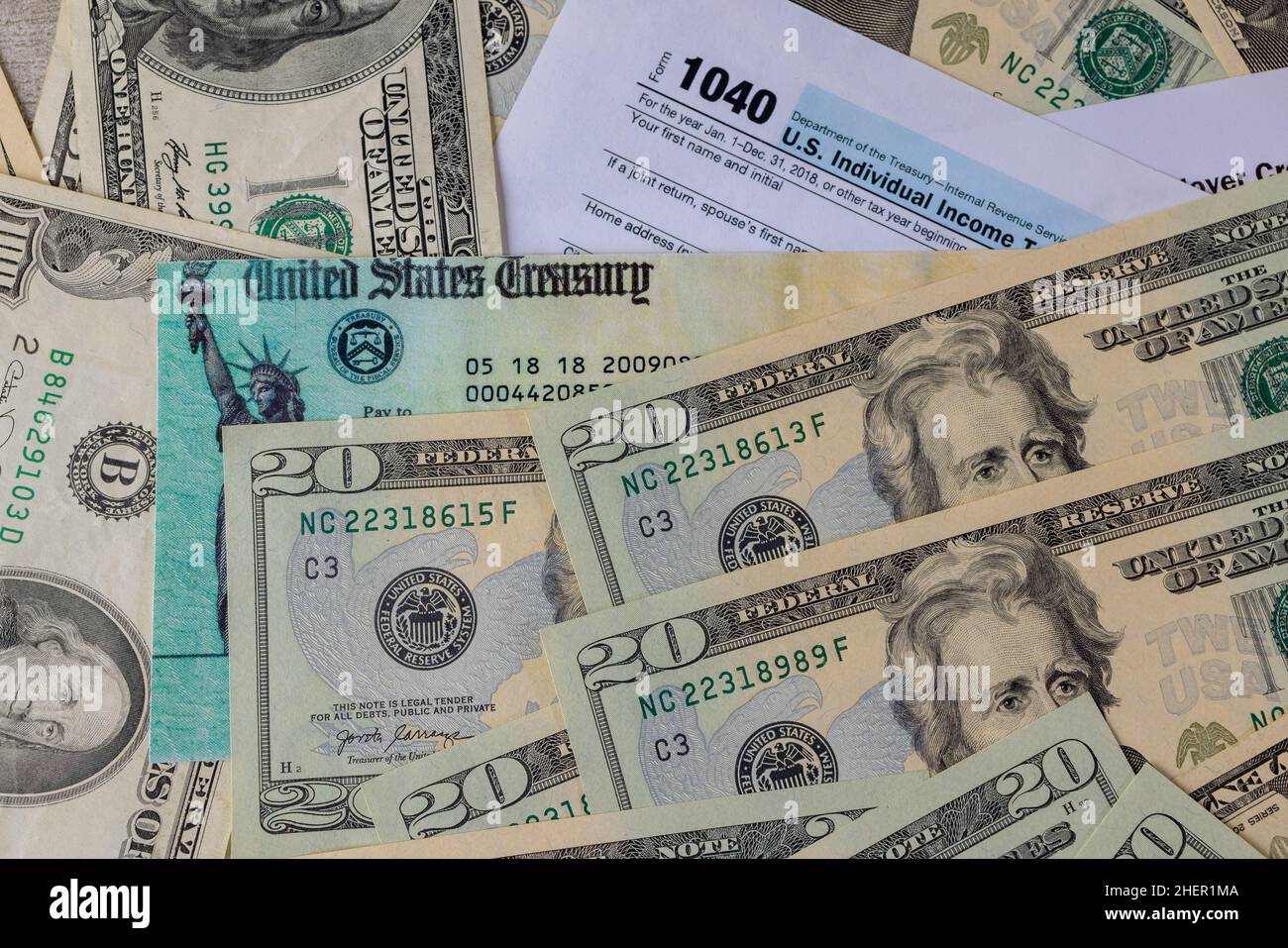 Accountant office in the U.S. blank tax forms 1040 estimated tax for individuals on dollar bill with income tax return Stock Photo