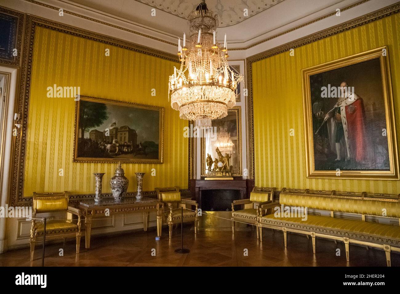 Inside King Friedrich I's royal assembly room with yellow silk damask wall coverings at Ludwigsburg Residential Palace, Germany. Antique and... Stock Photo