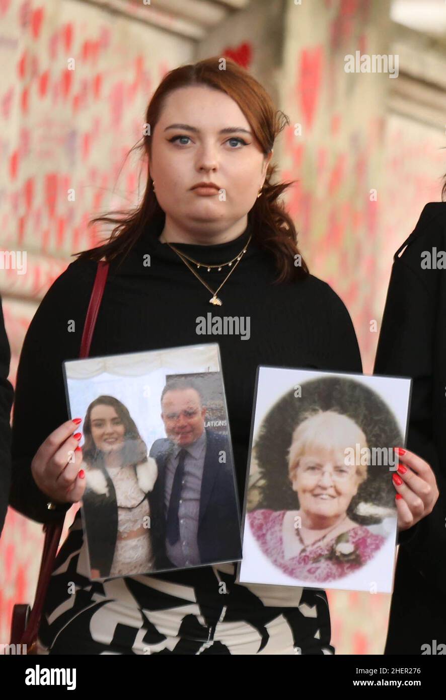 File photo dated 28/09/21 of Hannah Brady, holding up photos of her family members Shaun Brady and Margaret Brady, who she lost to coronavirus. Ms Brady, a spokesperson for campaign group Covid-19 Bereaved Families for Justice whose story was highlighted at PMQs by Sir Keir Starmer, said Tory MPs had a 'moral duty' to remove Boris Johnson. Issue date: Wednesday January 12, 2022. Stock Photo