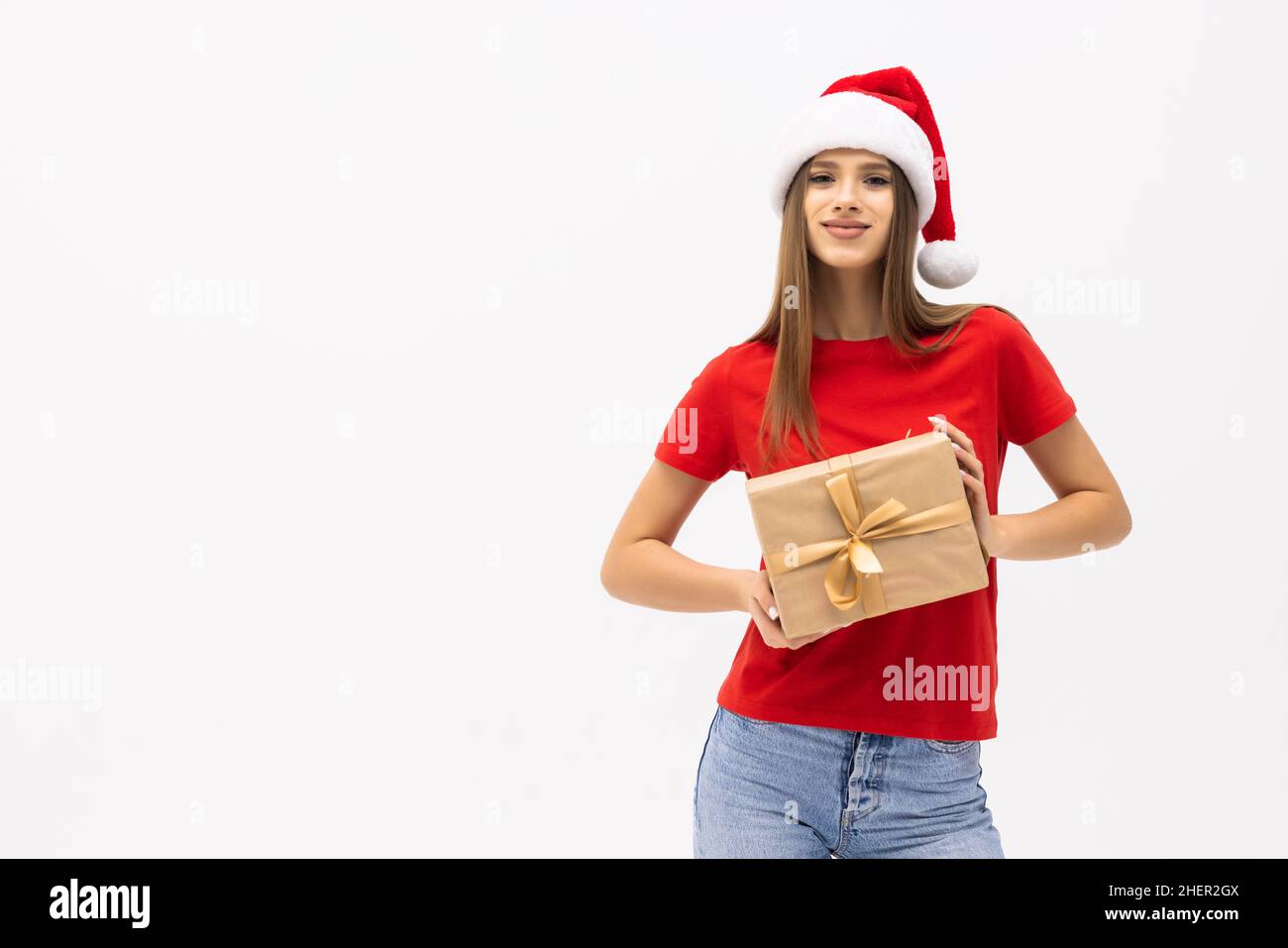 Cheerful woman in santa hat with presents isolated on white background ...