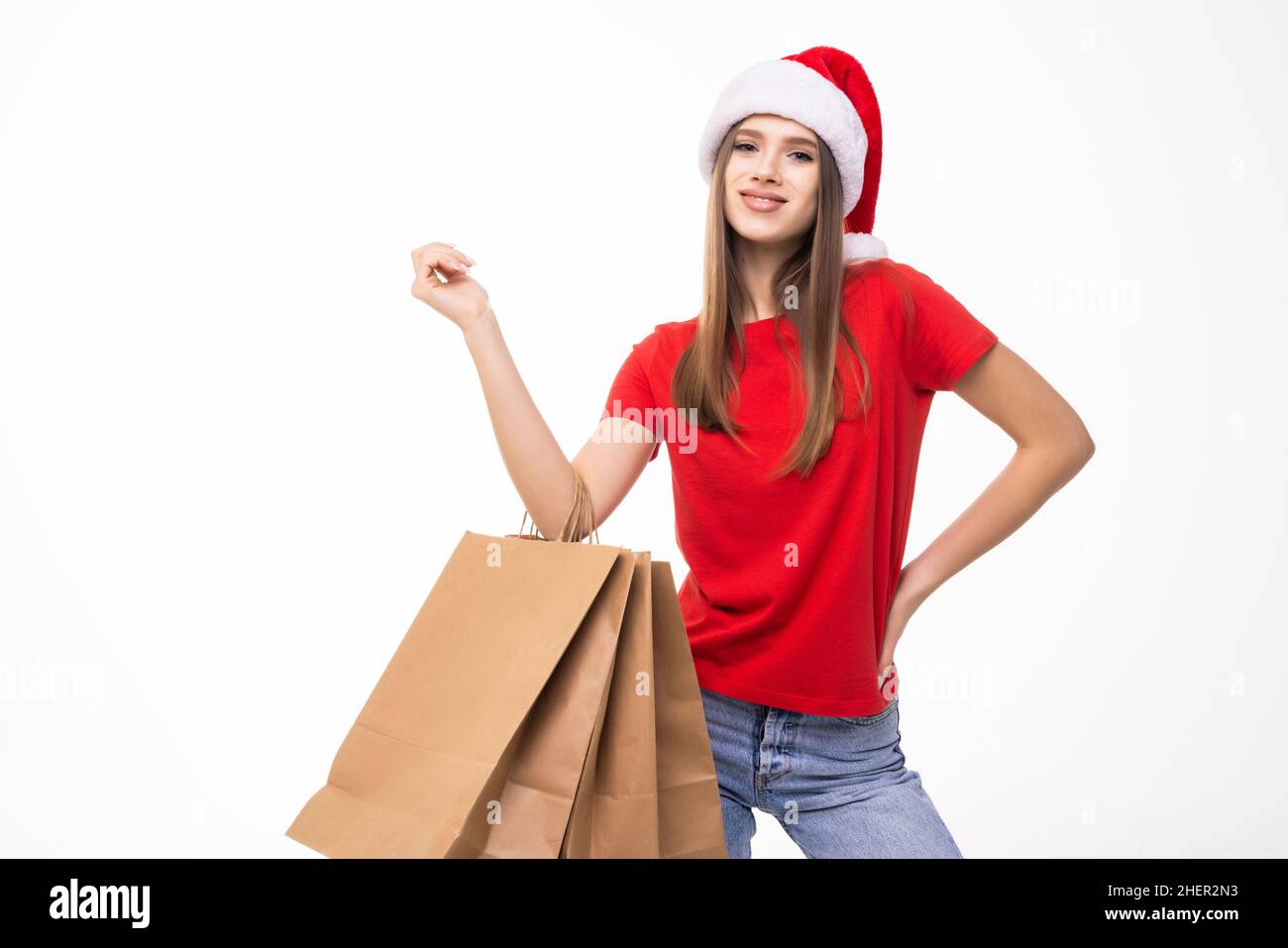Christmas woman holding shopping bags with gifts. Happy and smiling ...