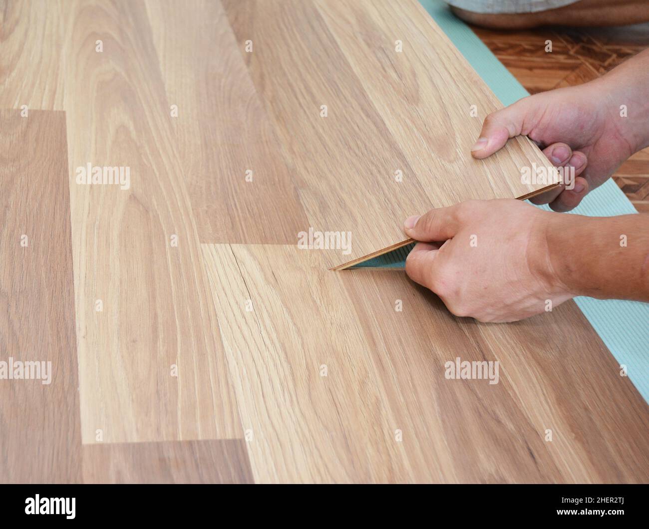 Laminate flooring installation. Installing wooden laminate flooring