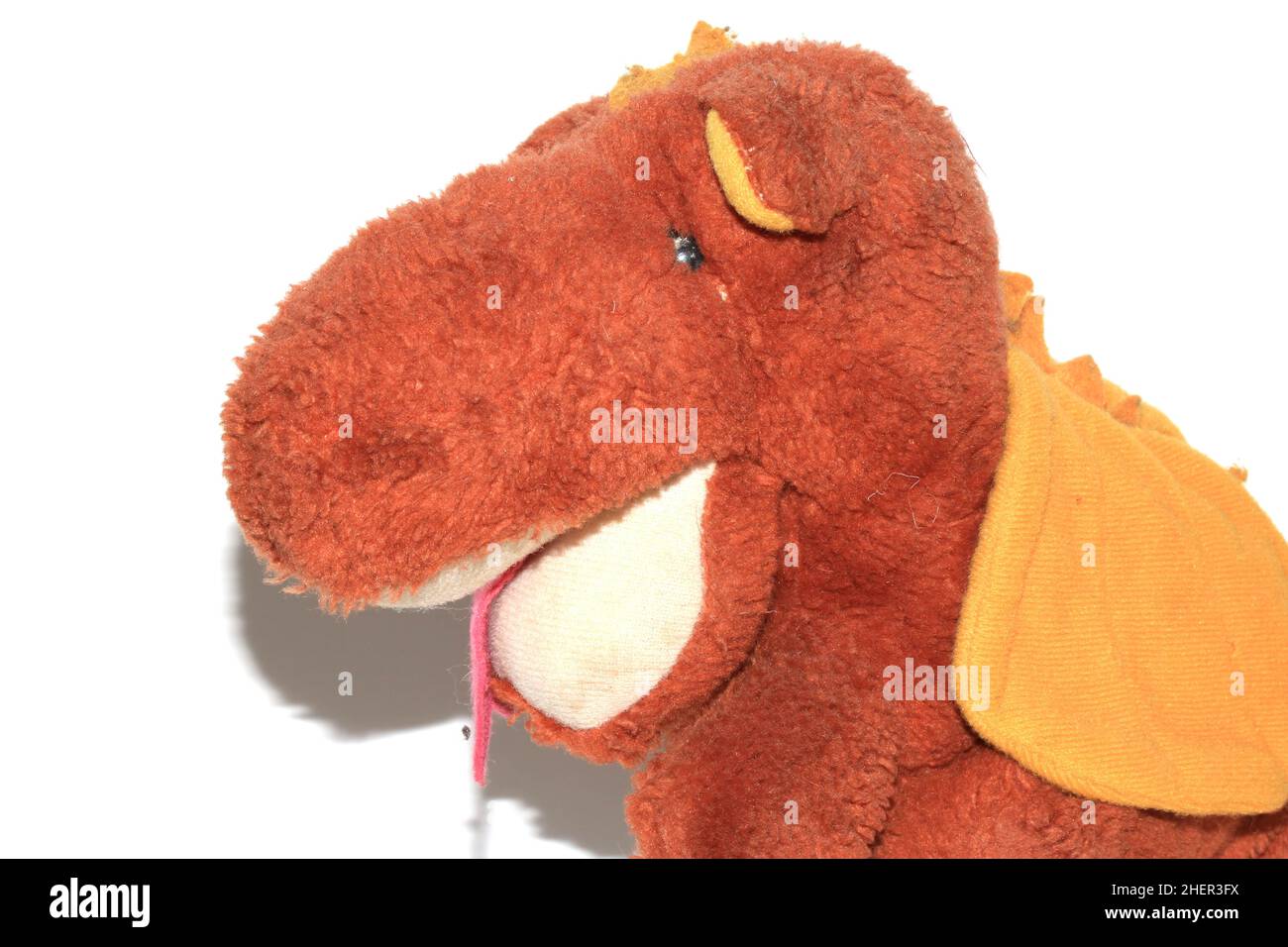 A Nostalga Old Stuffed Soft Toy Dragon Dinosaur Stock Photo