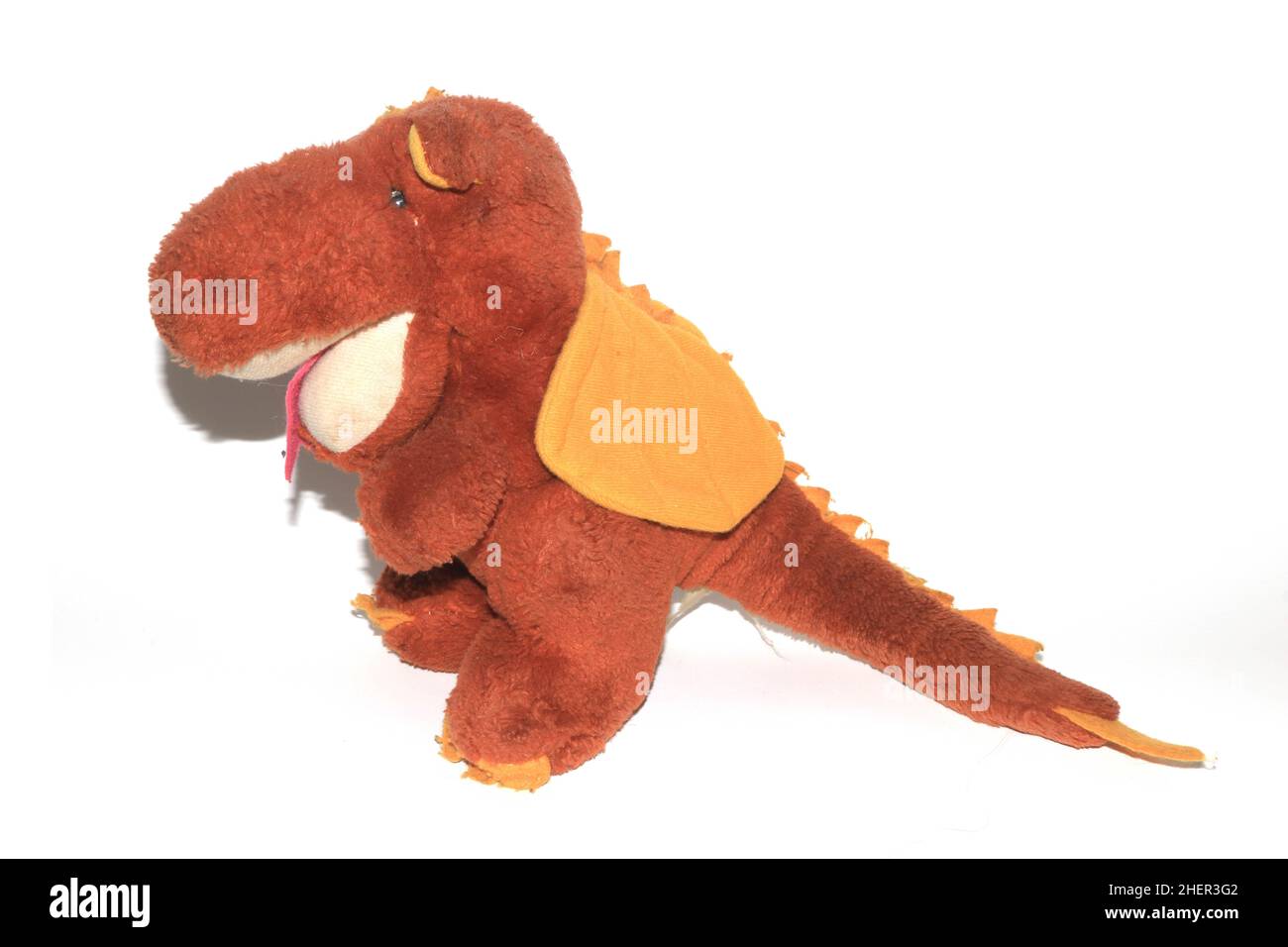 A Nostalga Old Stuffed Soft Toy Dragon Dinosaur Stock Photo
