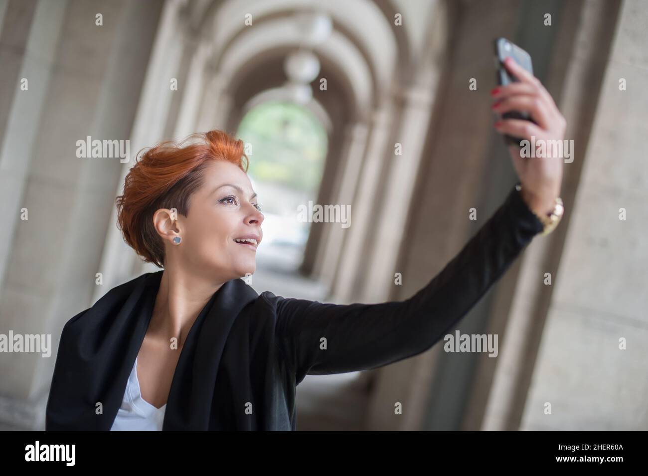 Pretty student girl taking a selfie with her cell phone Stock Photo - Alamy