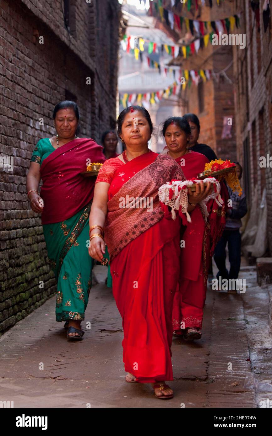 Procession of Newari women during Taa Din, part of Nepali New Year (Bisket Jatra) in the UNESCO World Heritage city of Bhaktapur. Stock Photo