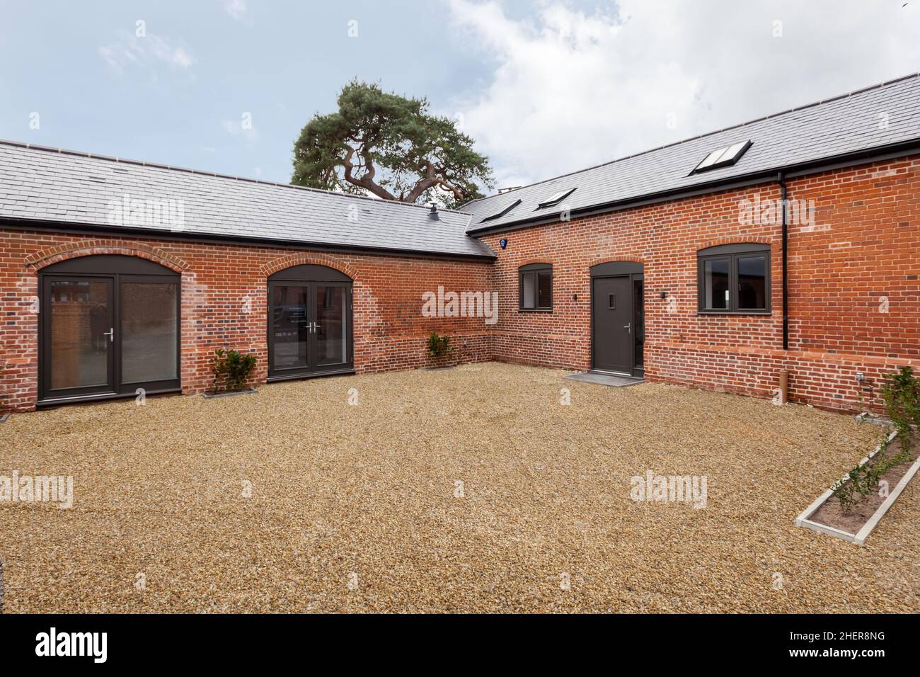 Cowlinge, Suffolk, England - 28 March 2019: Rear elevation of stylish ...