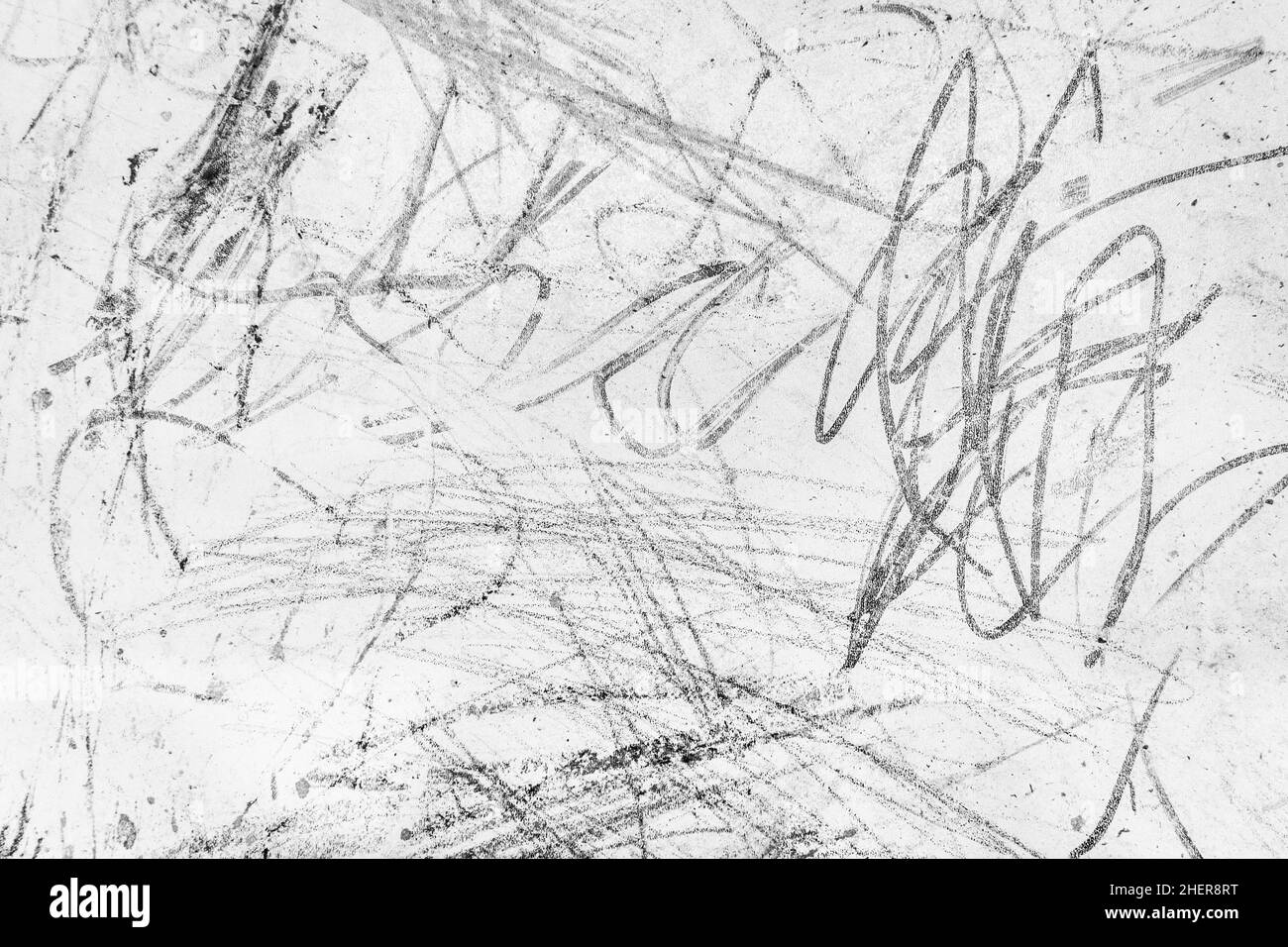 Abstract chaotic children's pattern pattern black crayon on white board dirty background. Stock Photo