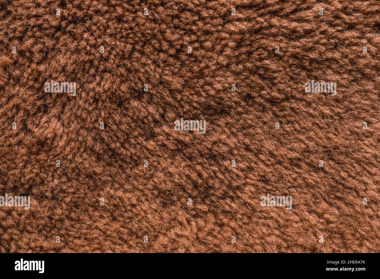 Brown natural fur or wool surface texture animal skin background. Stock Photo