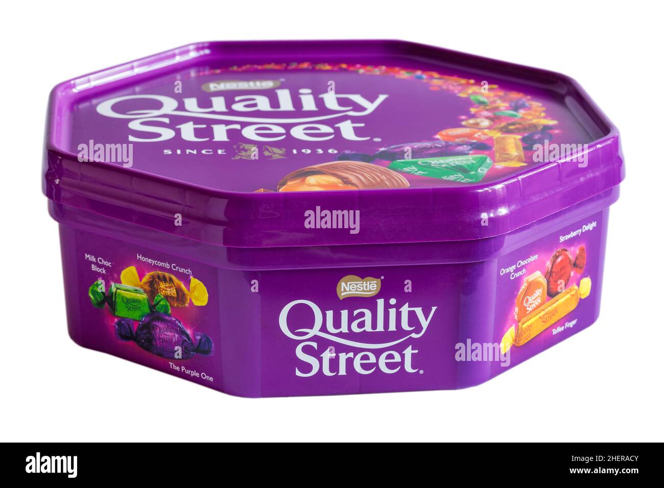 Tub of Nestle Quality Street chocolates sweets isolated on white background Stock Photo