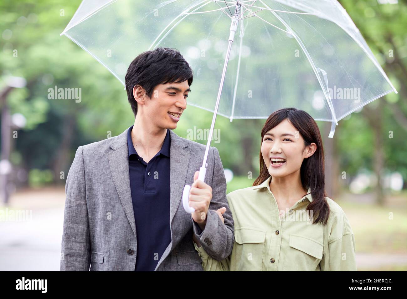 Japanese Couple Taking A Walk In The Park Stock Photo - Alamy