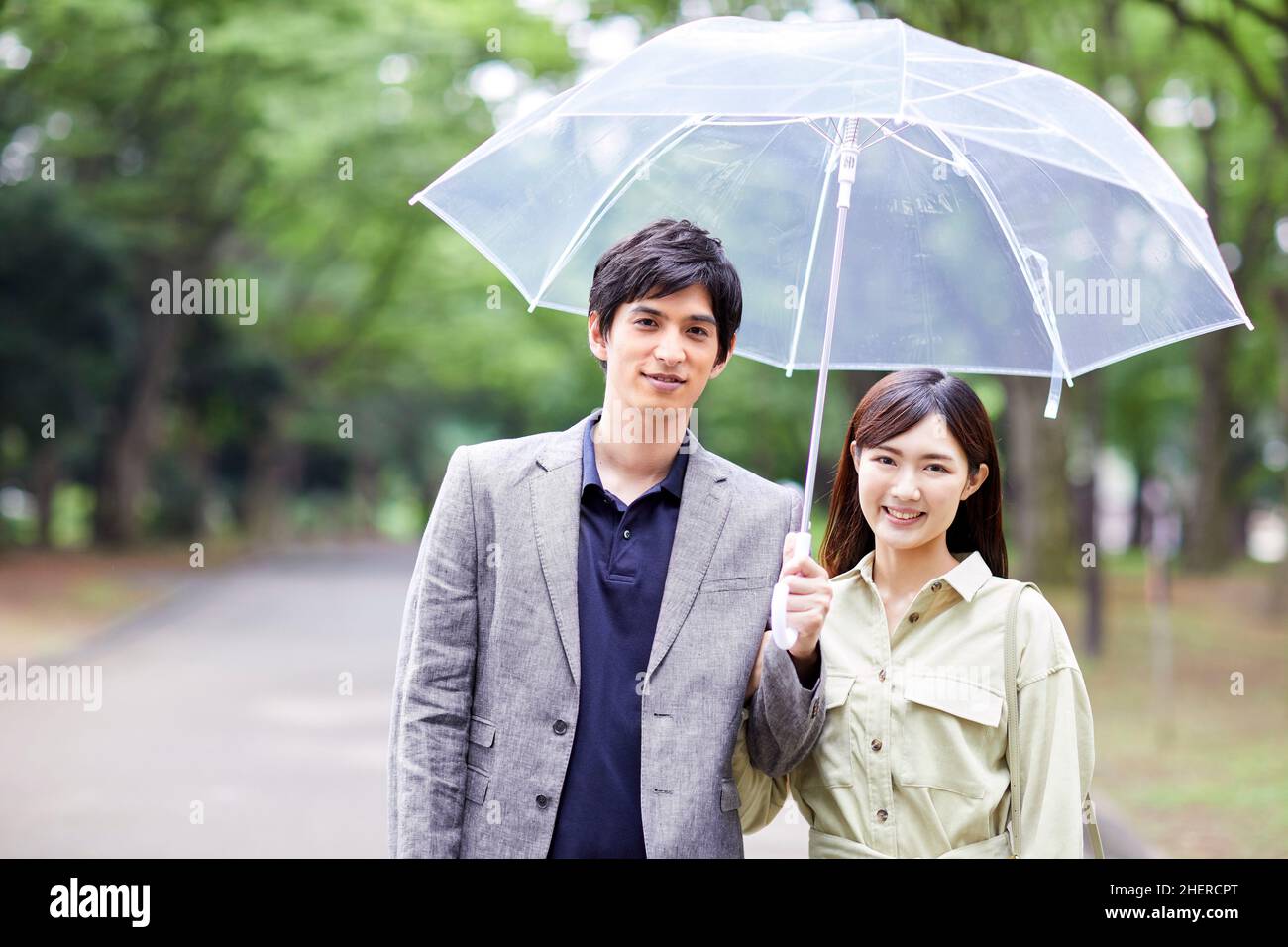 Japanese Couple Taking A Walk In The Park Stock Photo - Alamy
